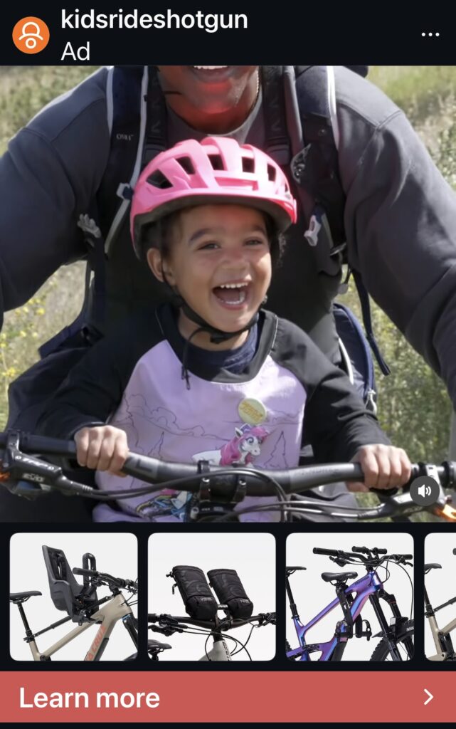 Image of a child smiling on a bike seat with parent imbeded in a social media ad with product info.